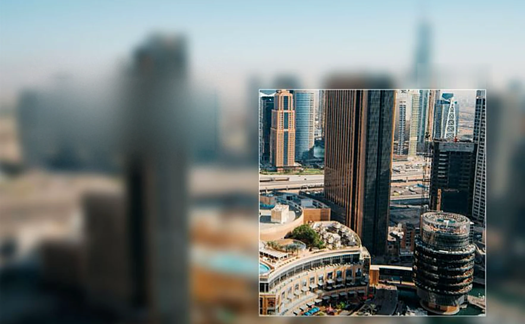 A city of towers, one framed in focus