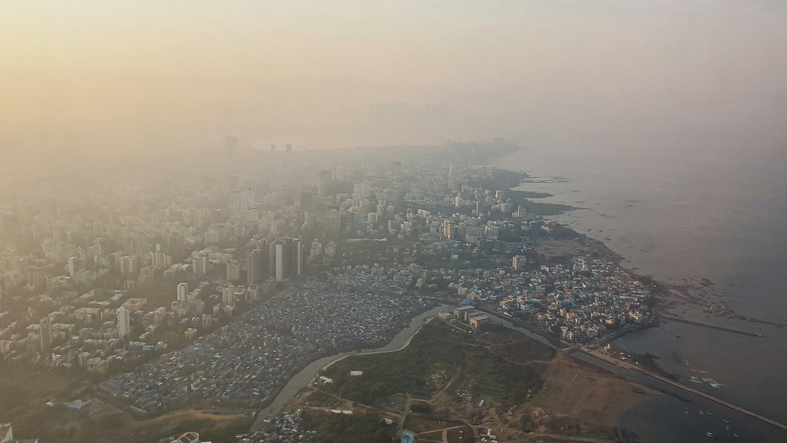 Aerial view over Mumbai's towers and the Arabian Sea